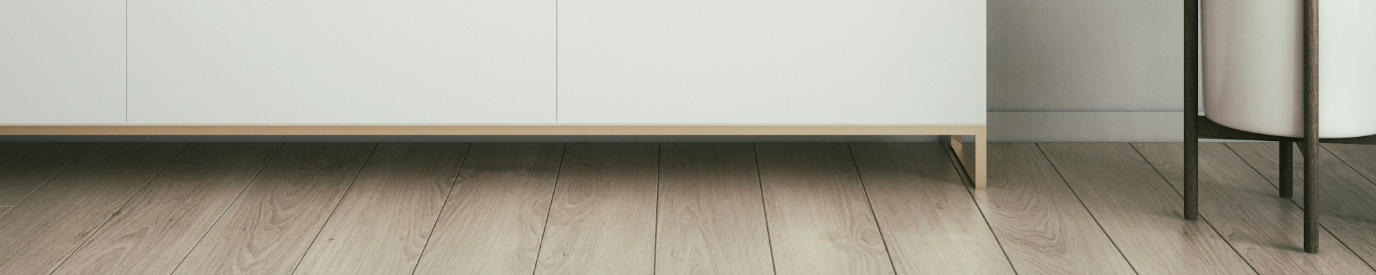 Living room with area rug and clean wood-look flooring